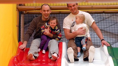 kids and parents on slide